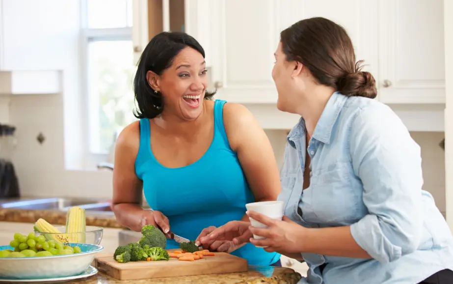 two women on a diet making healthy food together