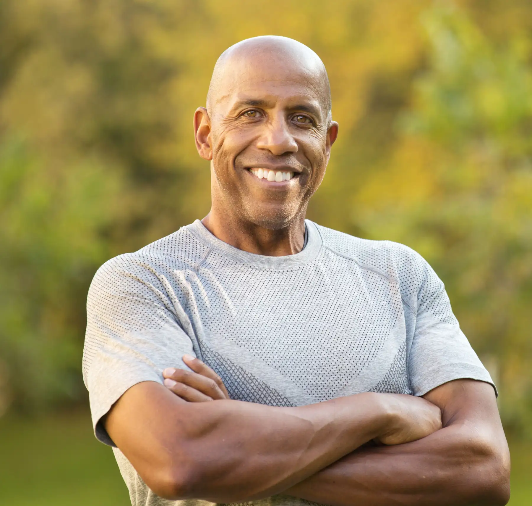 healthy middle aged man smiling after weight loss